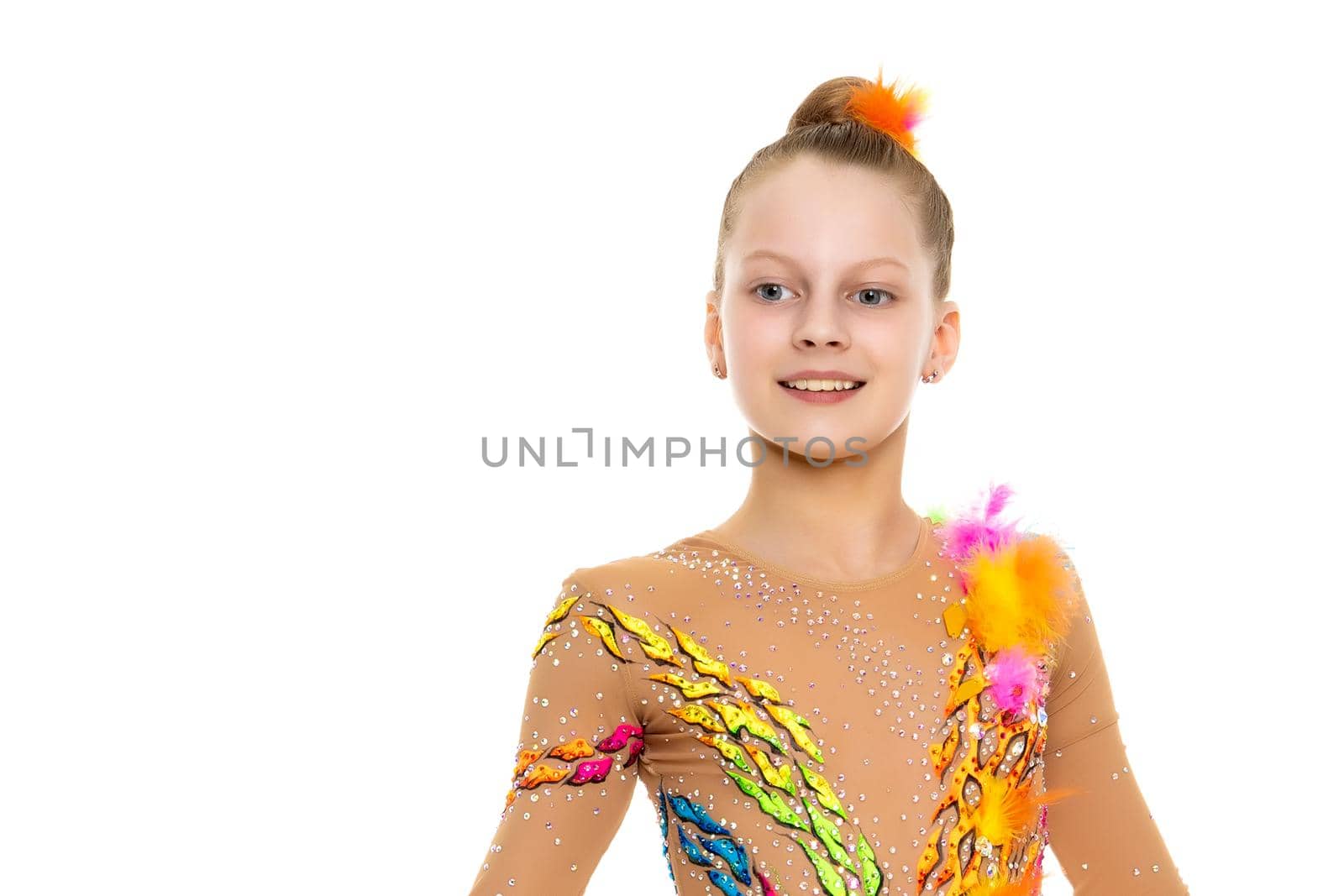 Little girl gymnast in a beautiful sports swimsuit for competitions, close-up. The concept of sport and fitness, a happy childhood. Isolated on white background.