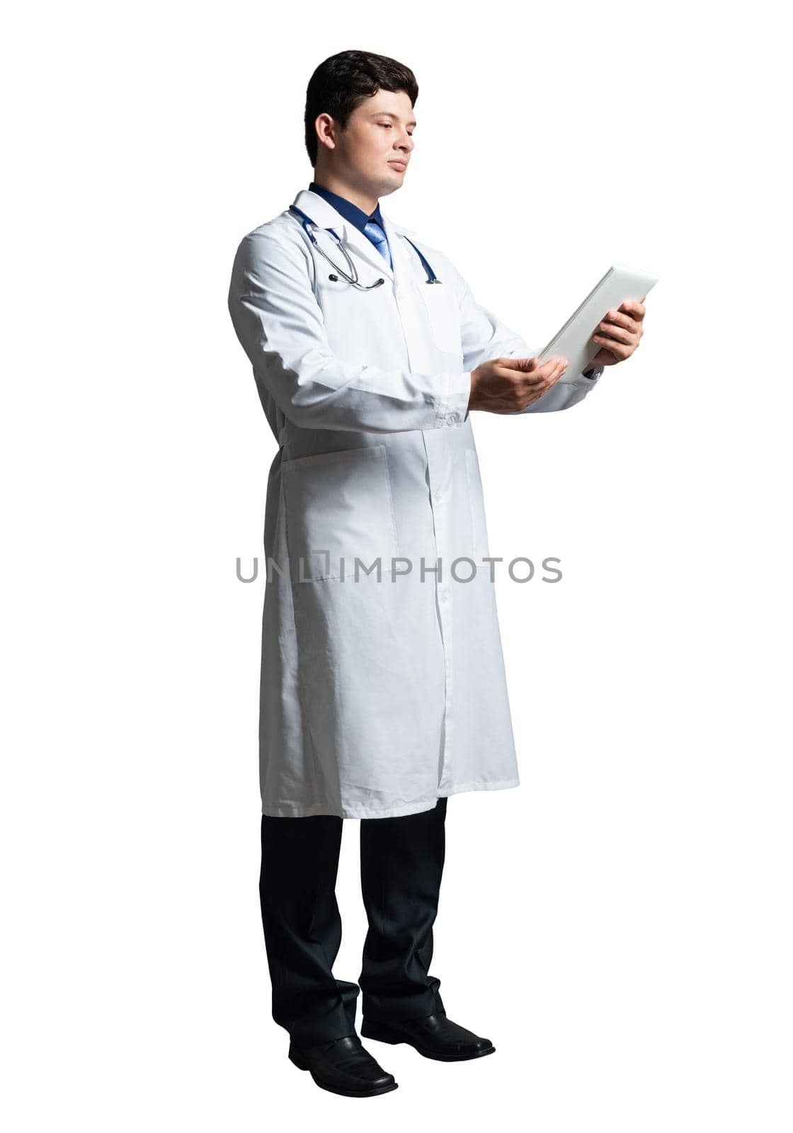 young doctor with a tablet computer, in a white medical coat and with a stethoscope