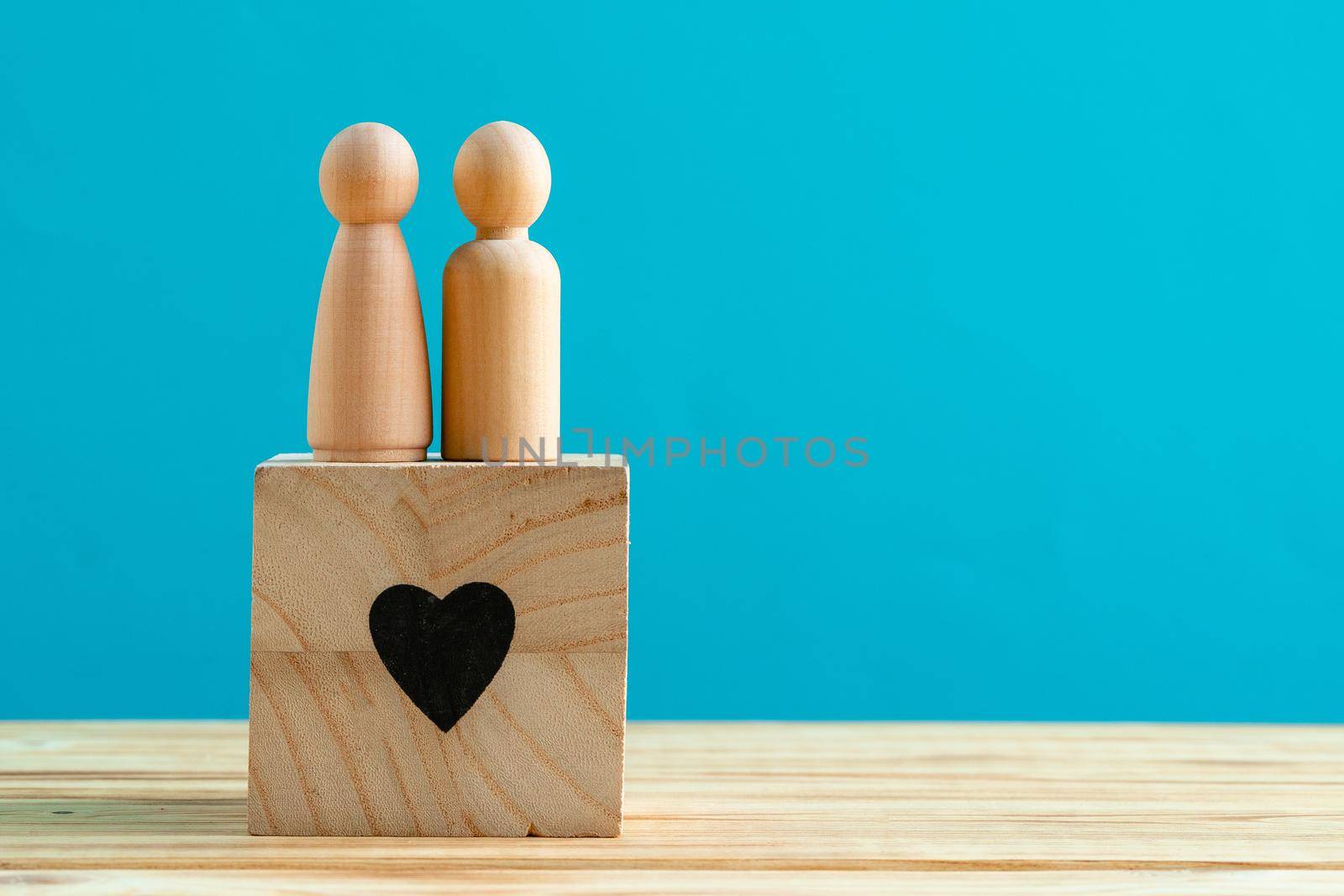 Small wooden figures of family members close up. Family relationship symbol