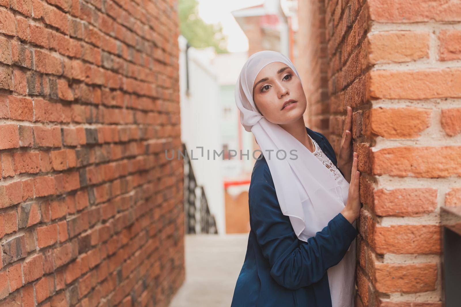 Portrait of a Muslim woman posing outdoors. Modern islamic female concept.