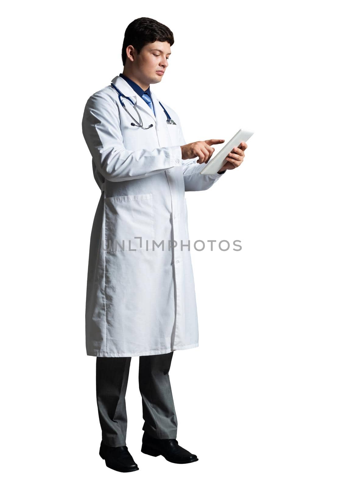 young doctor with a tablet computer, in a white medical coat and with a stethoscope