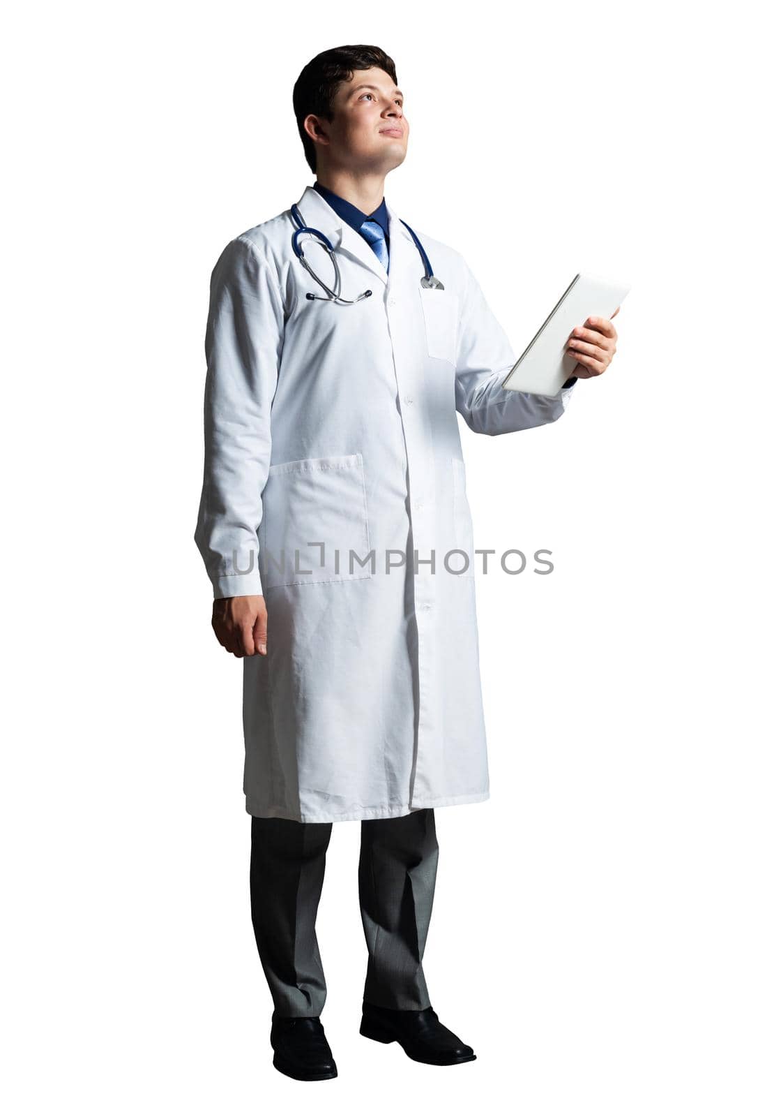 young doctor with a tablet computer, in a white medical coat and with a stethoscope