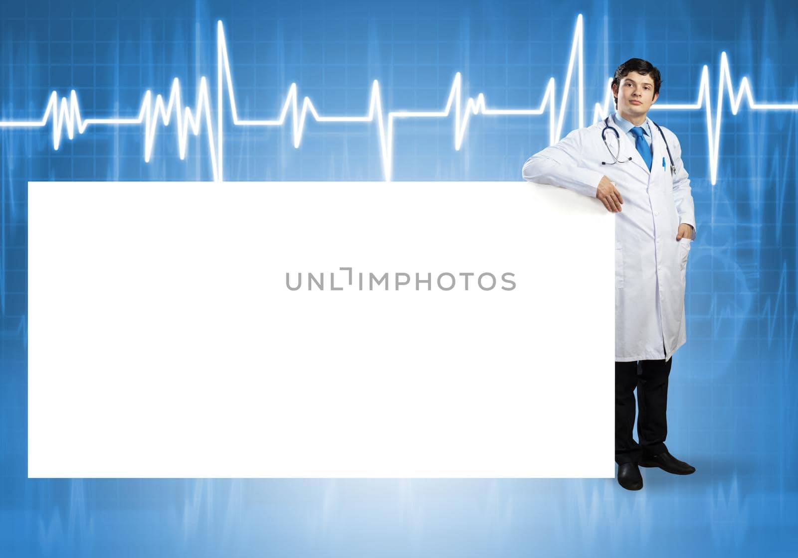 Young handsome doctor with white blank banner. Place your text