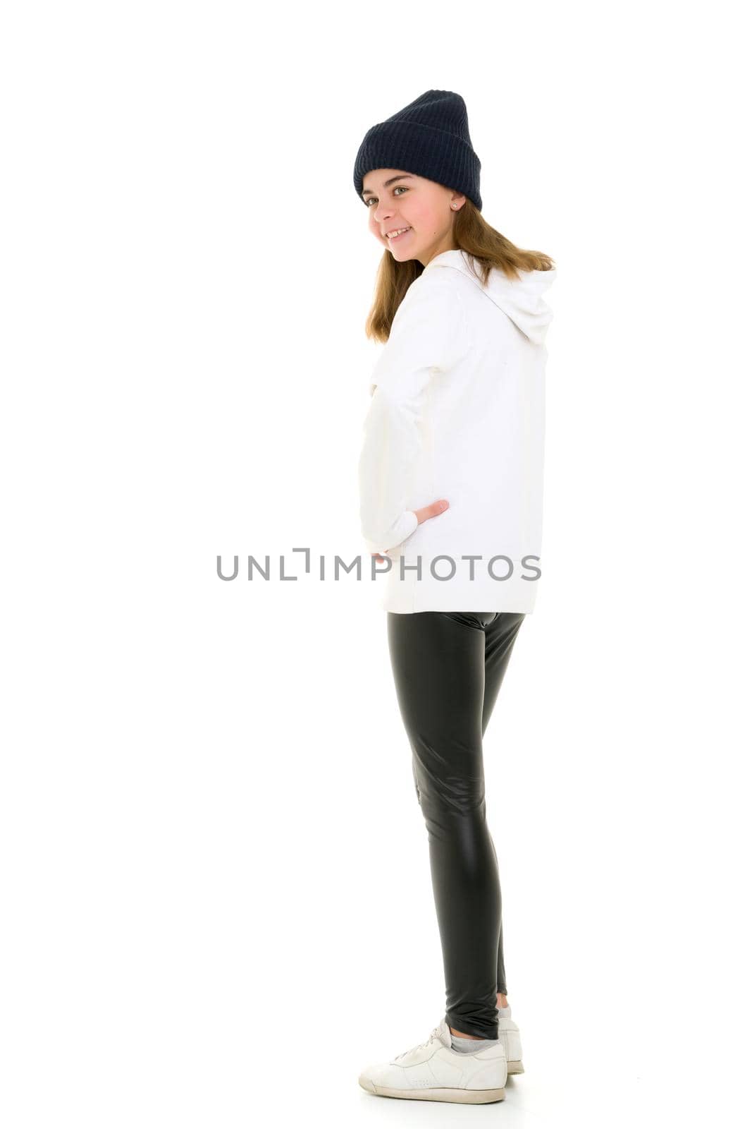 Portrait of a gymnast girl in a tracksuit. Isolated on white background