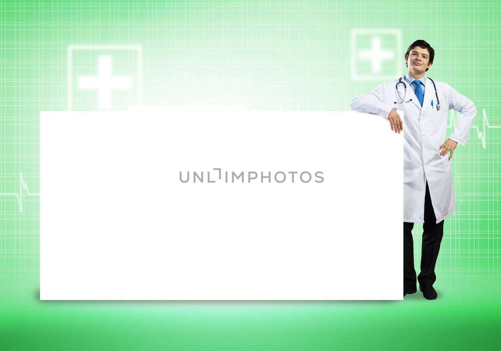 Young handsome doctor with white blank banner. Place your text