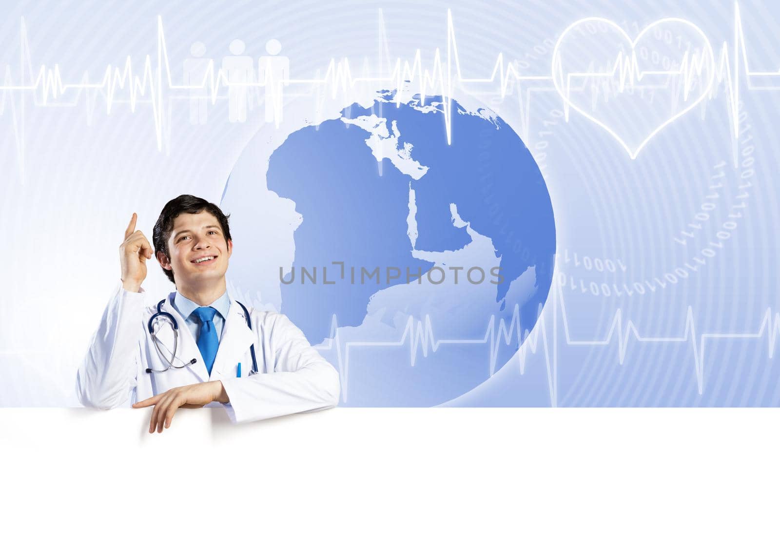 Young handsome doctor holding white blank banner. Place your text