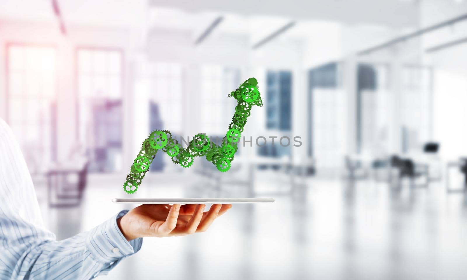 Growing graph made of gears and cogwheels on white office background. Mixed media