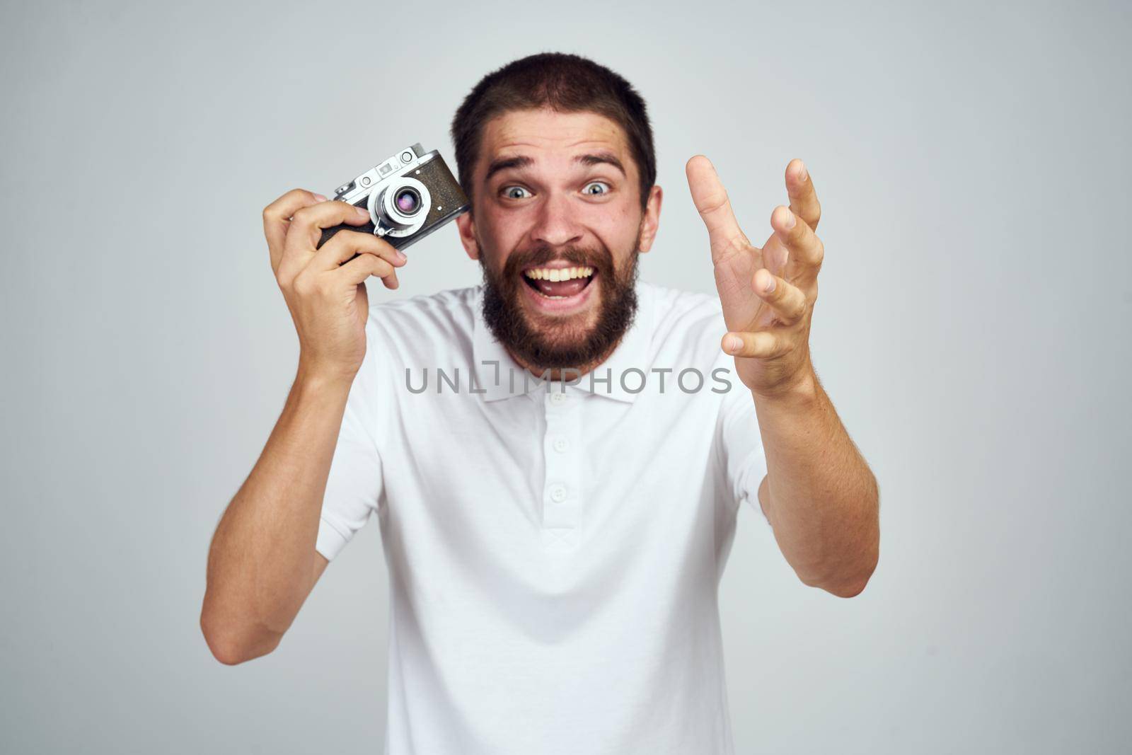 bearded man photographer professional camera lifestyle light background by Vichizh