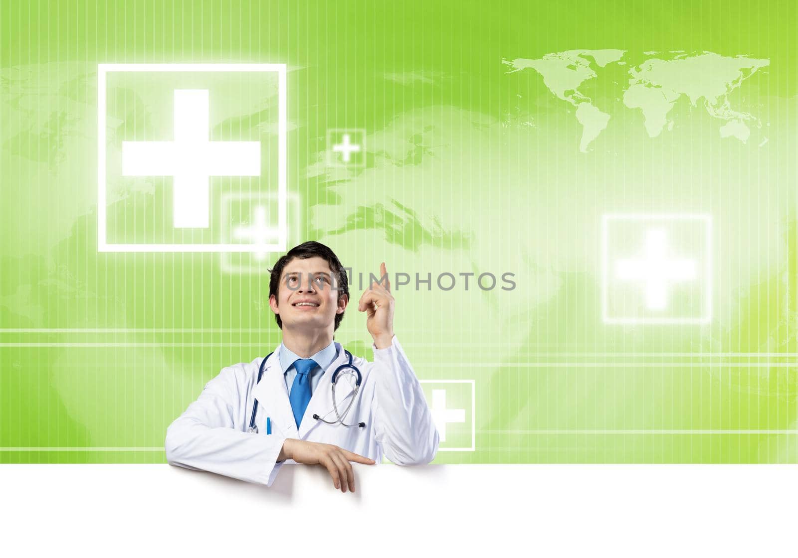 Young handsome doctor holding white blank banner. Place your text