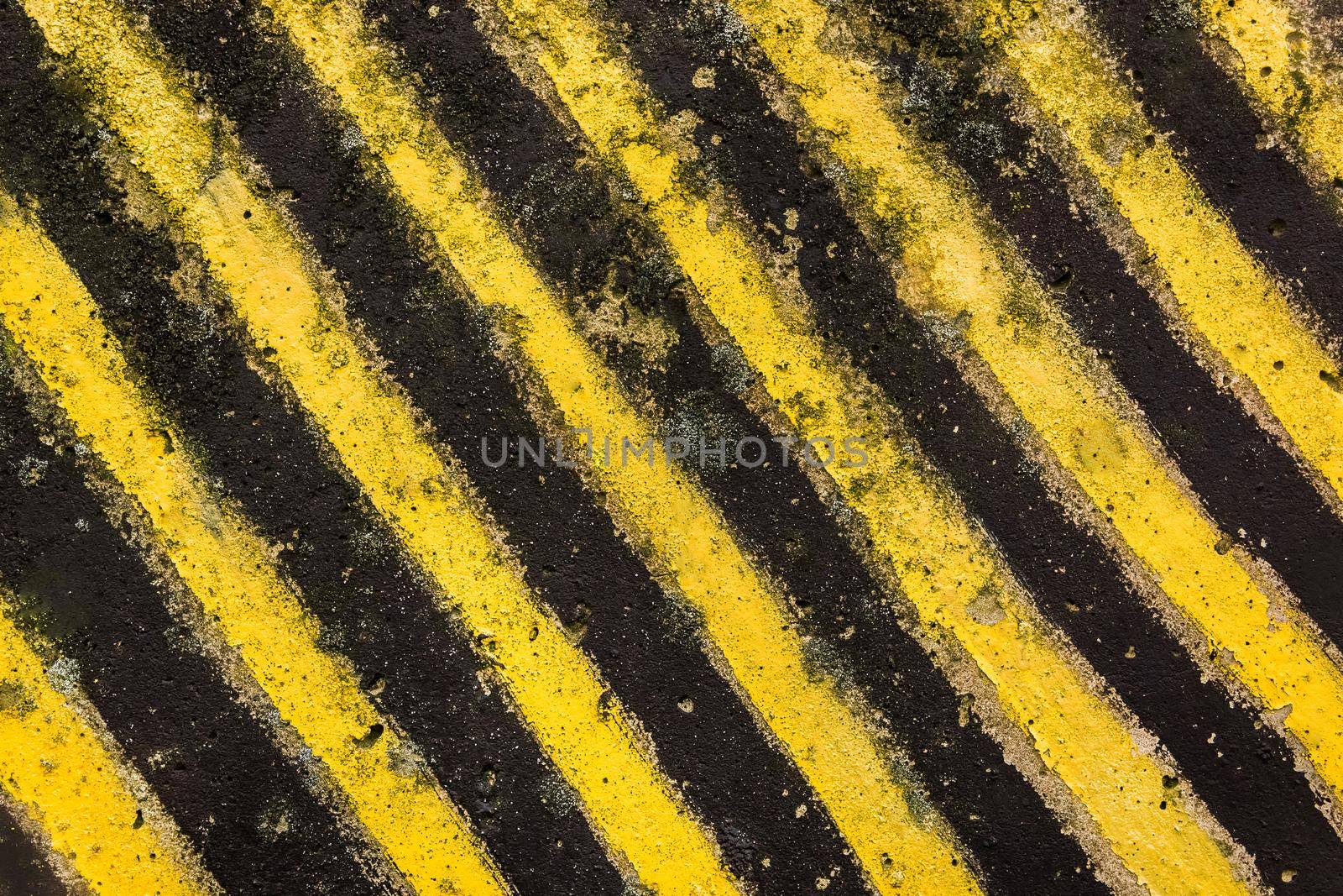 Hazardous restricted area designation, black and yellow diagonal lines on concrete texture background by AYDO8