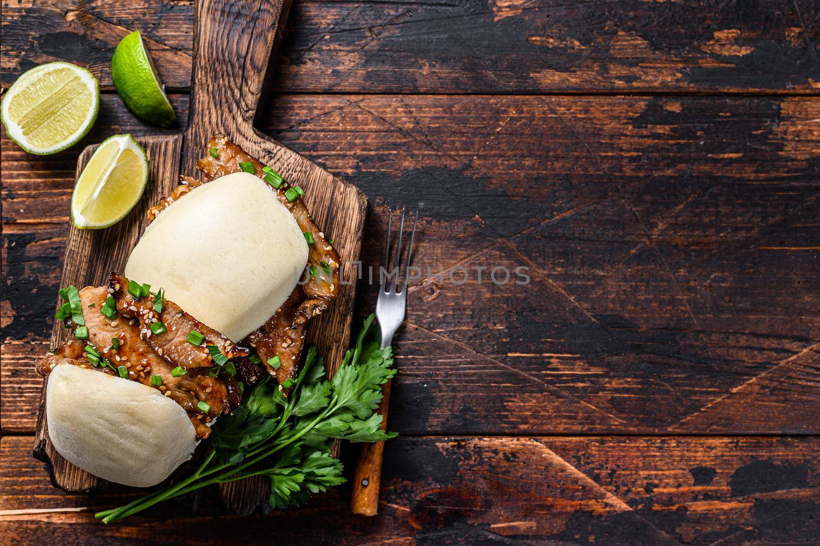 Chinese sandwich steamed gua bao buns with pork. Black background. Top view. Copy space by Composter