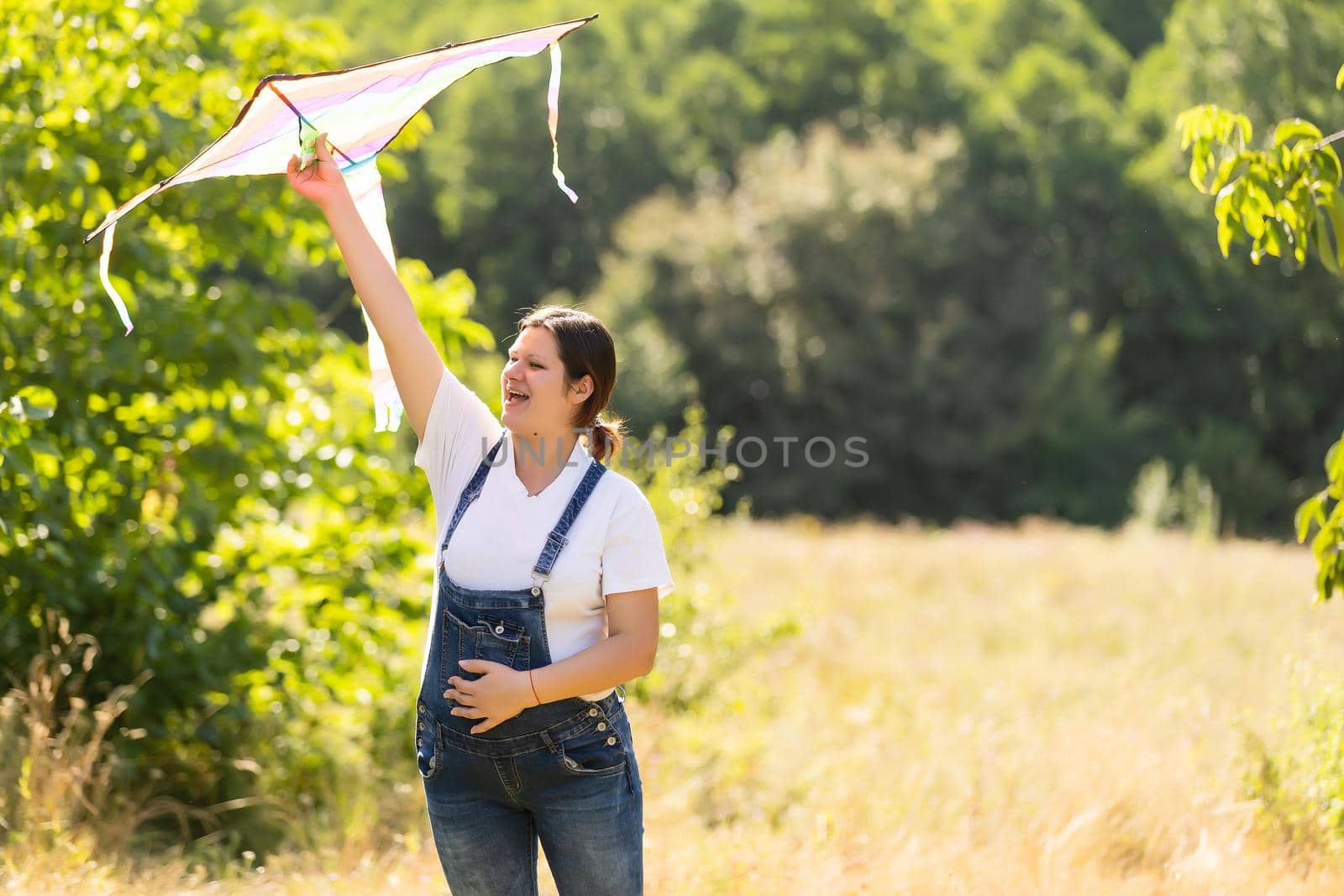 pregnant woman with a kite