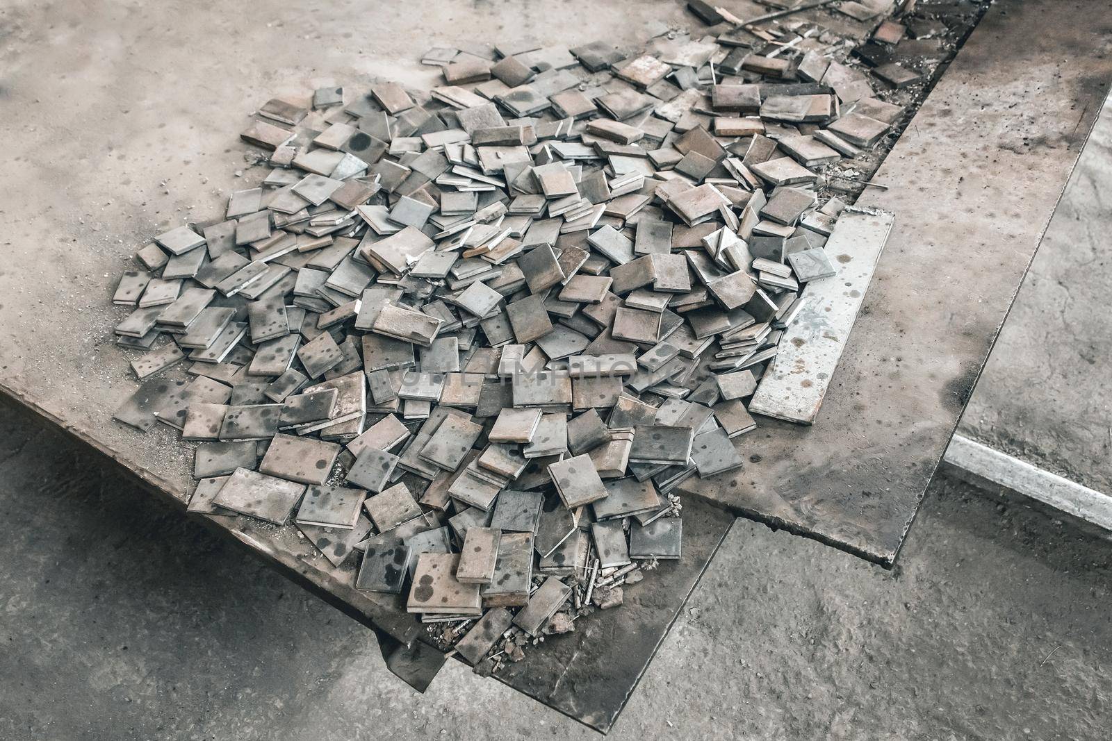 Metal waste, embedded parts for concrete structures with reinforcement, iron plates, industrial waste at the construction site by AYDO8