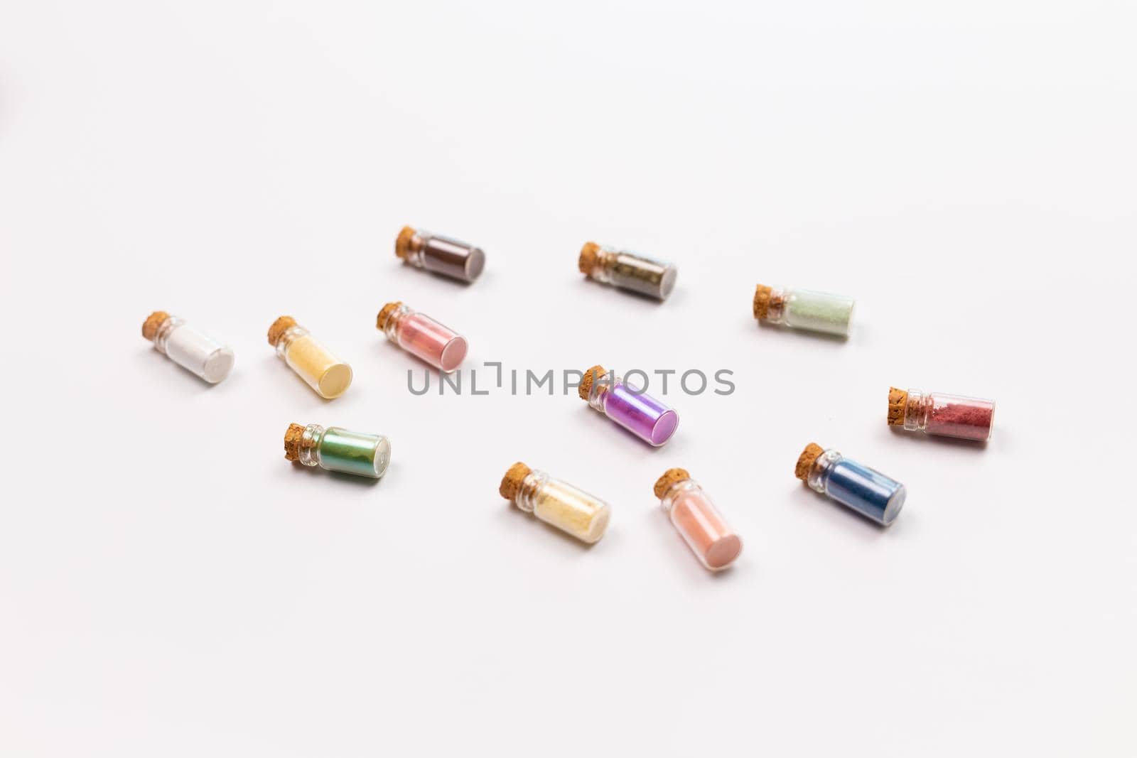 Eyeshadow in the small glass boxes on white background. Makeup product and mineral cosmetic.