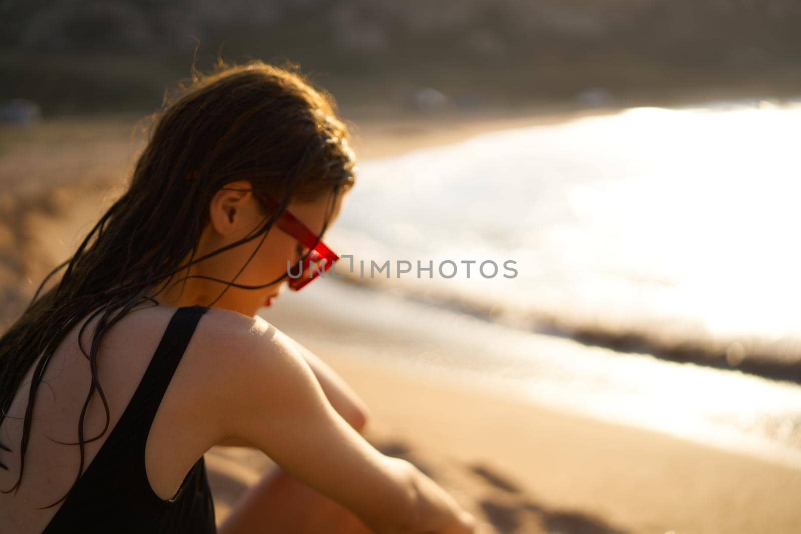 woman in a black swimsuit on the beach sea Summer vacation. High quality photo