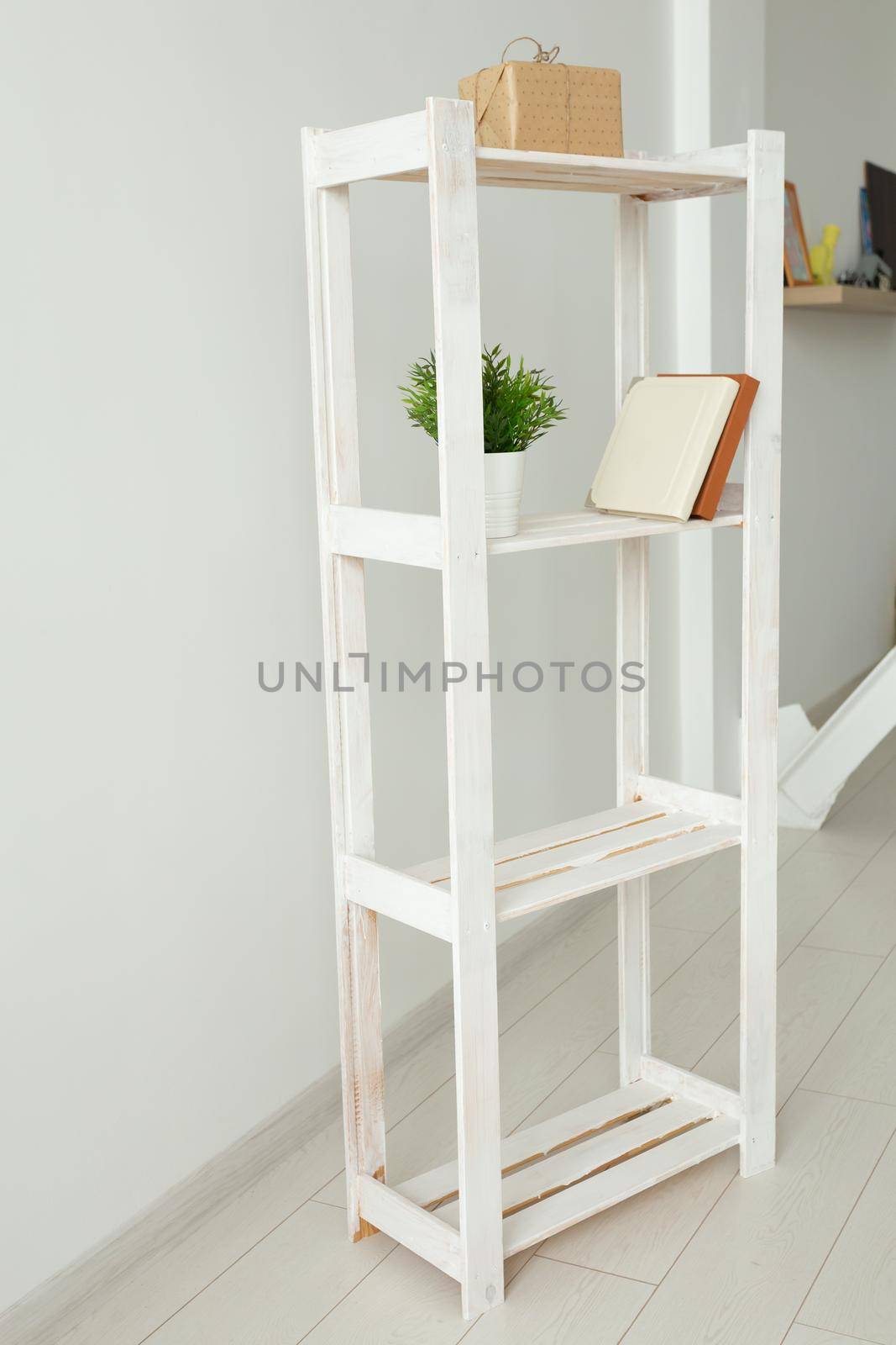 Rack with books and retro camera. Interior, minimalism and room decor