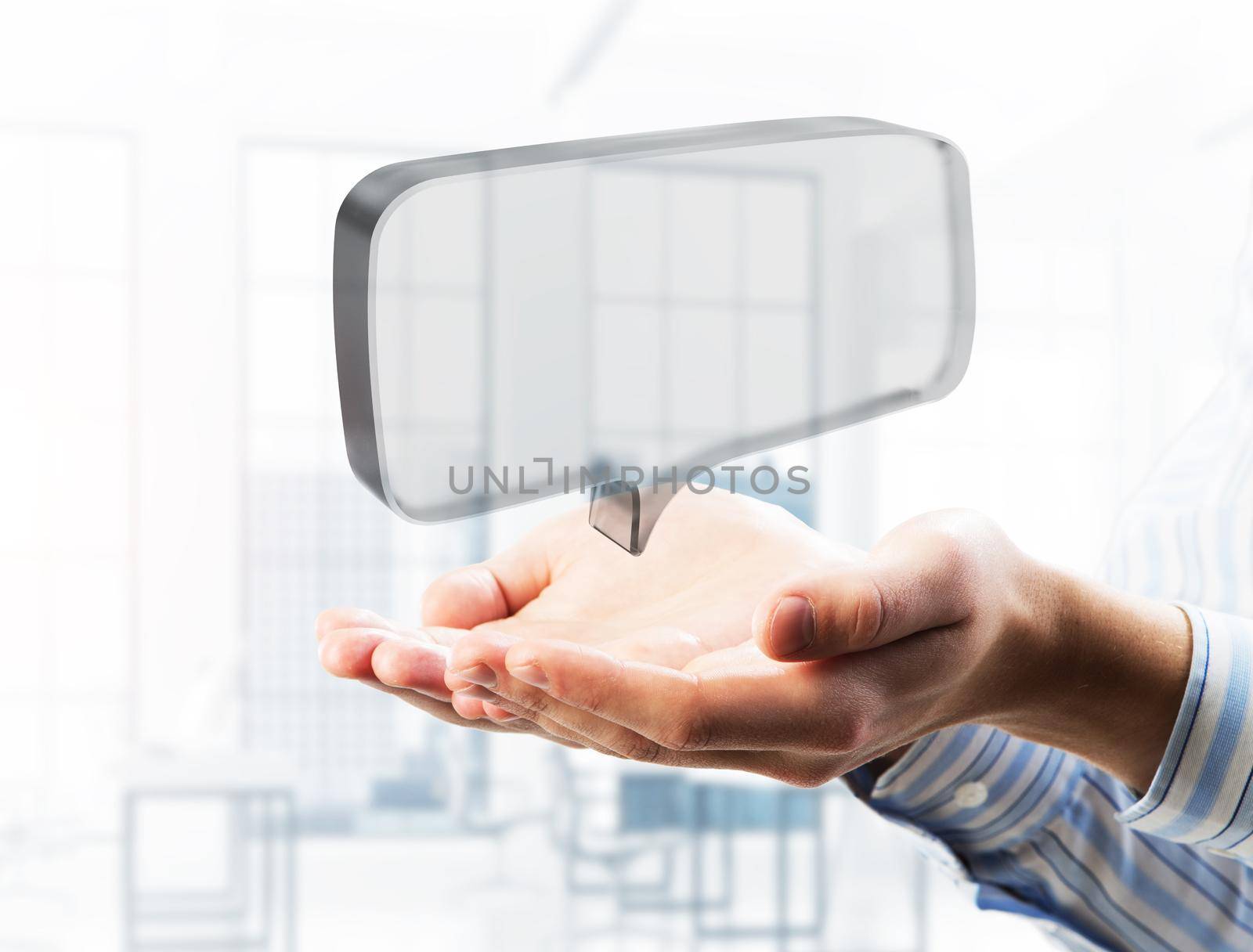 Close of businessman hands showing glass speech bubble as internet concept. Mixed media