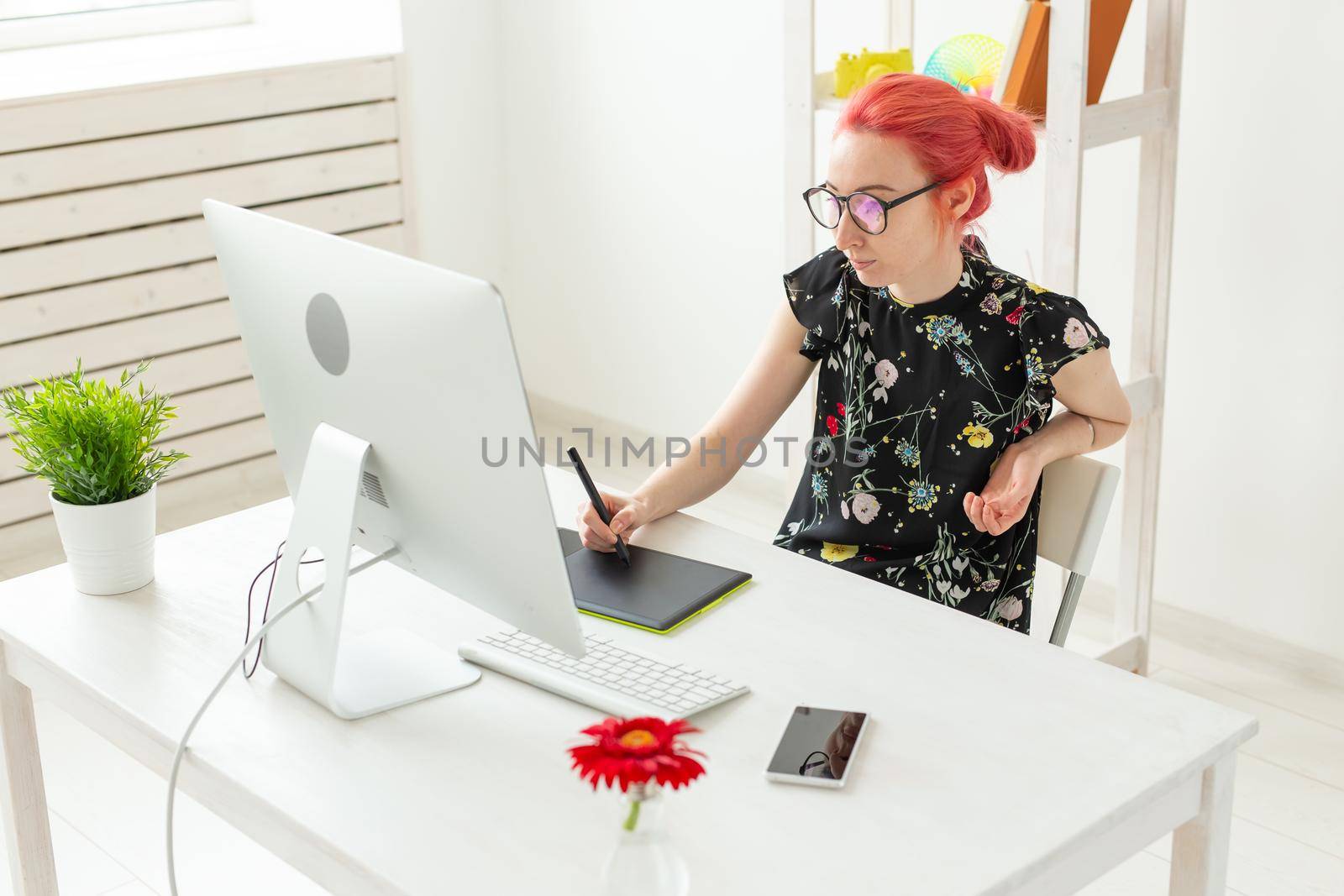 Illustrator, creative, web design concept - Female graphic designer at work.