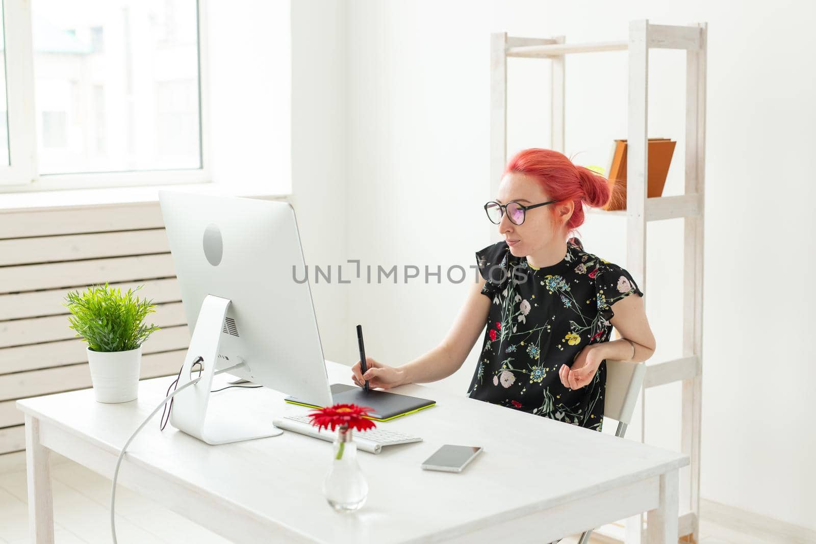 Creative, illustrator, graphic and people concept - Creative businessman writing or drawing on graphic tablet while using laptop in office