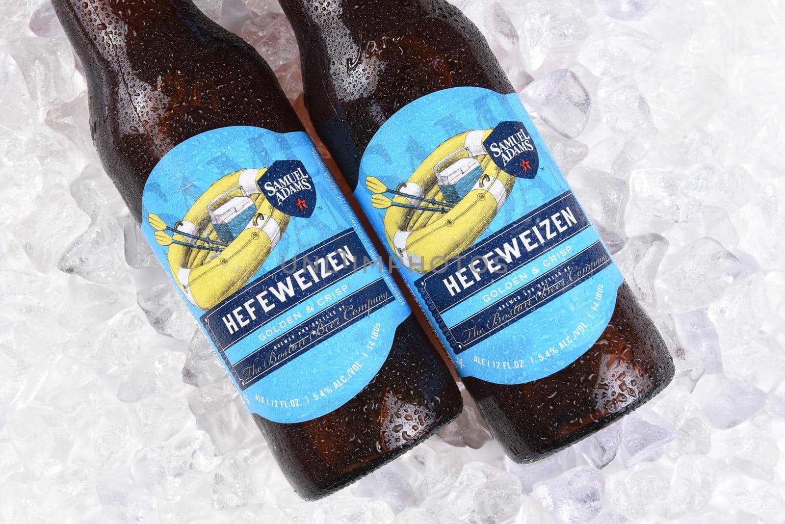 IRVINE, CA - JULY 16, 2017: Samuel Adams Hefeweizen bottle on ice. From the Boston Beer Company. Based on sales in 2016, it is the second largest craft brewery in the U.S.