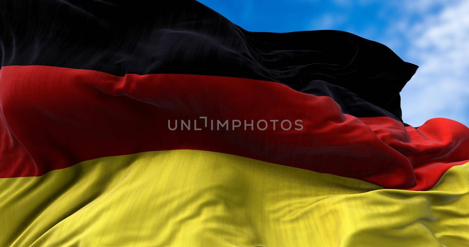 Detail of the national flag of Germany flying in the wind by rarrarorro