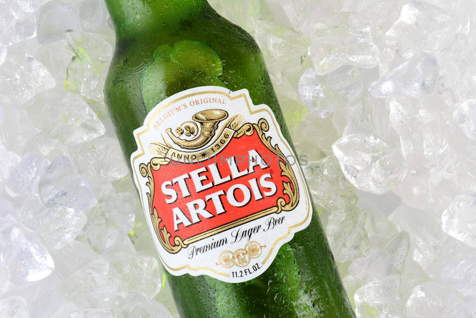 IRVINE, CA - JANUARY 11, 2015: A bottle of Stella Artois Beer closeup on Ice. Stella has been brewed in Leuven, Belgium, since 1926, and launched as a festive beer, named after the Christmas star.