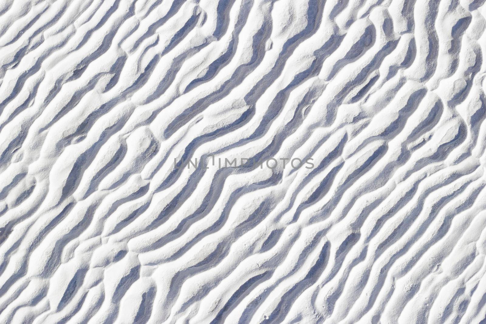 White texture of Pamukkale calcium travertine, pattern of diagonal waves by Laguna781