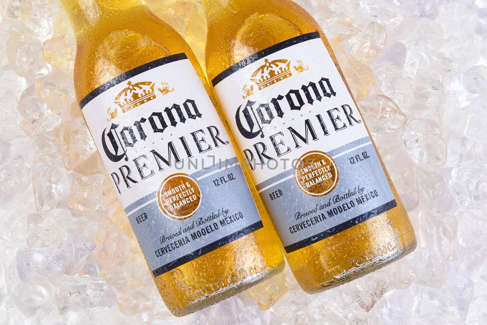 IRVINE, CALIFORNIA - MARCH 21, 2018:  Two bottles of Corona Premier on ice. Corona Premier is premium light beer with 2.6 grams of carbs and 90 calories.