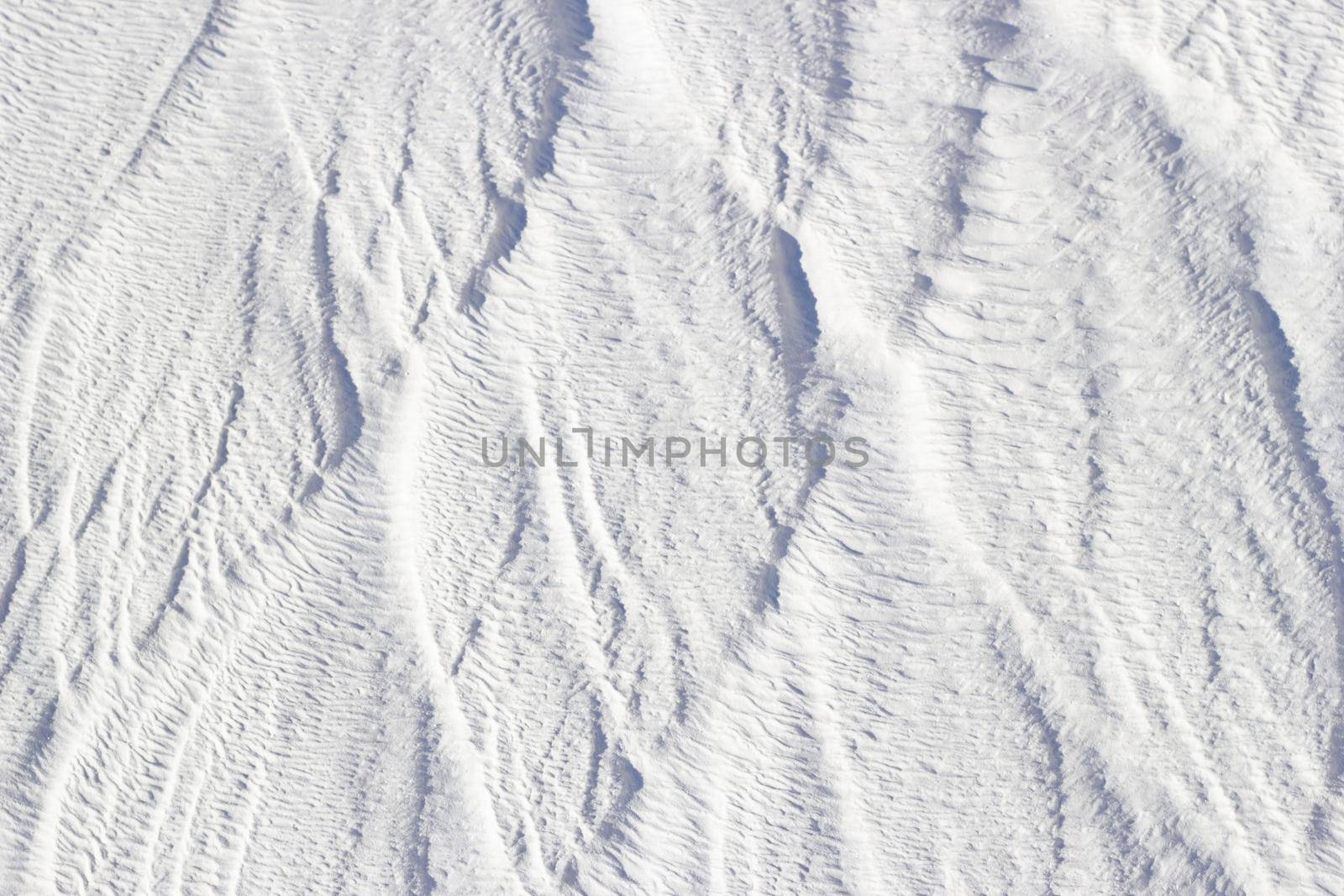 White texture of Pamukkale calcium travertine in Turkey, vertical pattern of the feathers close-up.