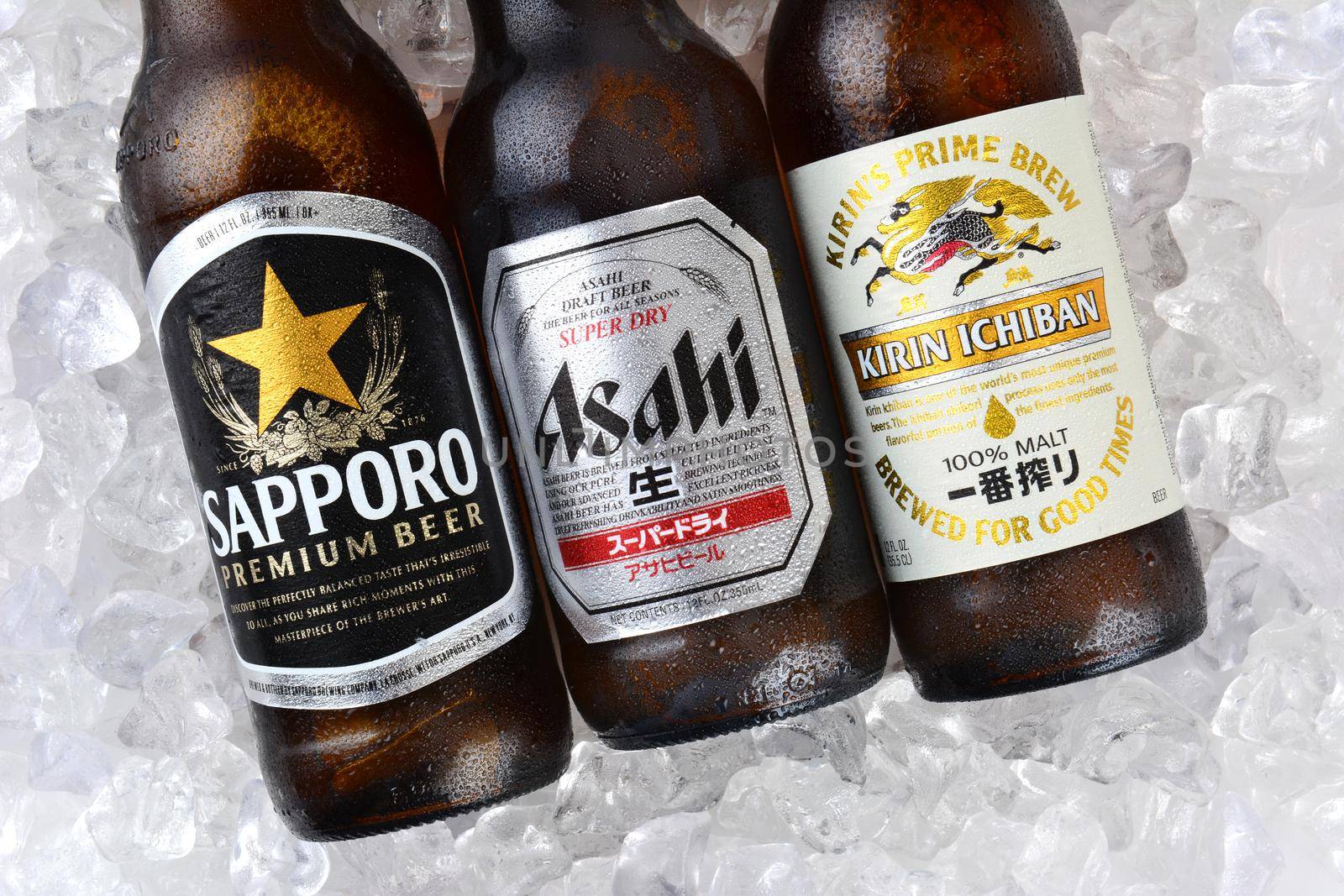 IRVINE, CA - JANUARY 11, 2015: Three bottles of Japanese beers on a bed of ice. Sapporo, Asahi and Kirin Ichiban are three of the most popular Japanese beers imported into the USA
