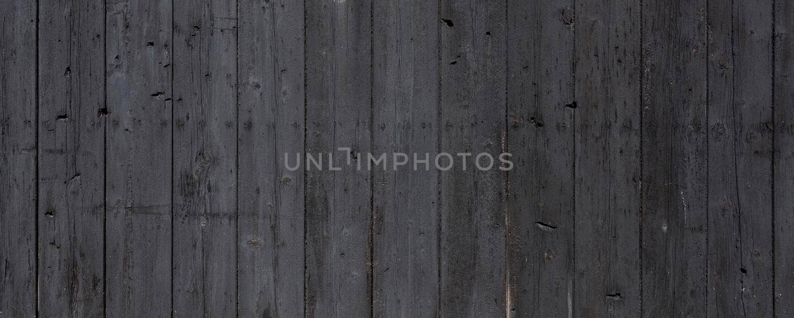 black background of vertical wooden old grungy painted planks by ahavelaar