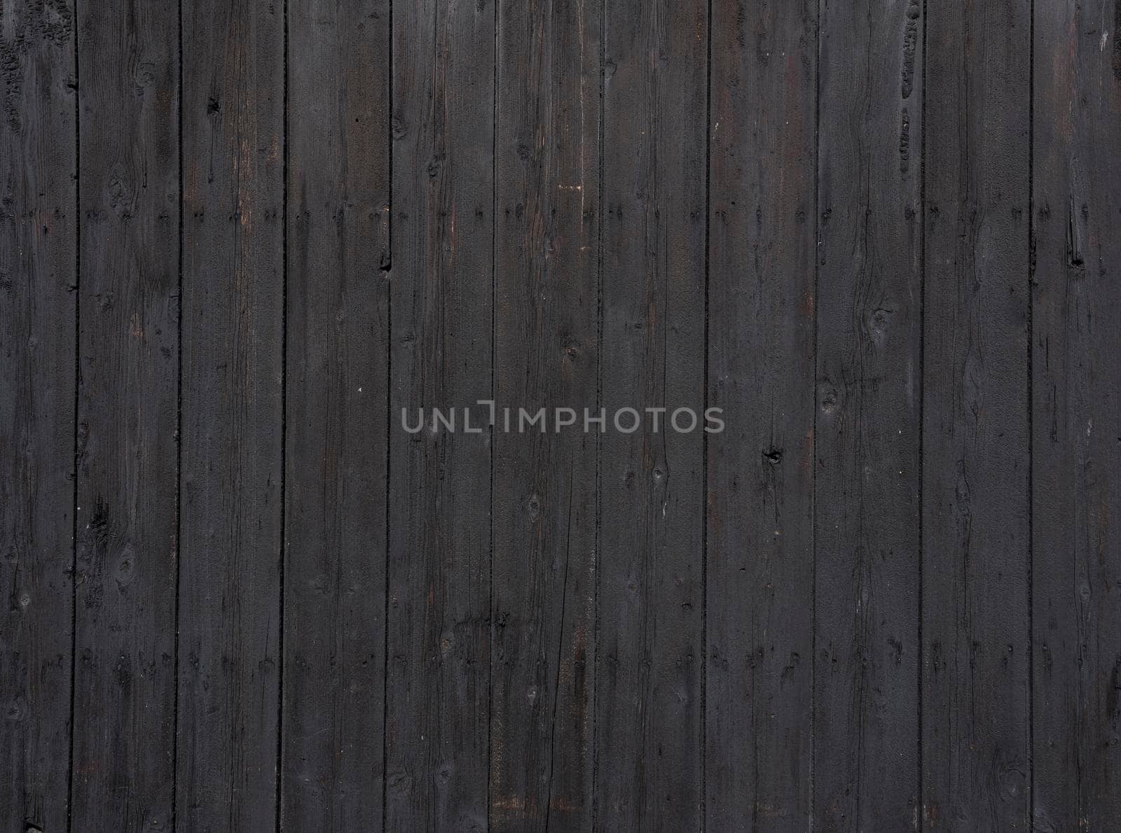 black background of vertical wooden old grungy painted planks by ahavelaar
