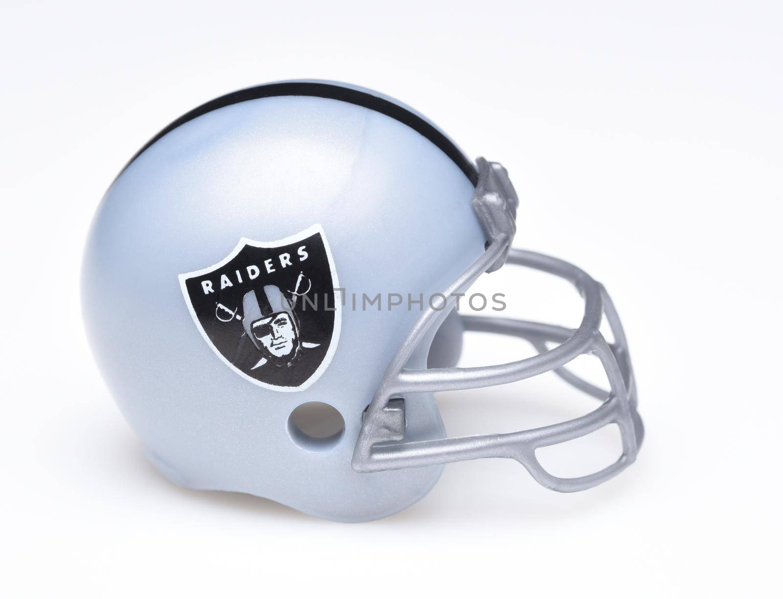 IRVINE, CALIFORNIA - AUGUST 30, 2018: Mini Collectable Football Helmet for the Oakland Raiders of the American Football Conference West. 