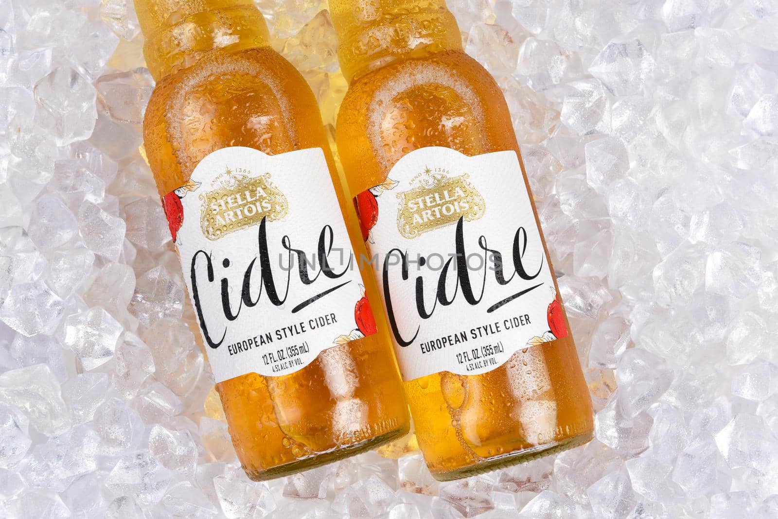 IRVINE, CALIFORNIA - 2 JUNE 2020: Closeup of two bottle of Stella Artois Cider, European Style Hard Apple cider, on a bed of ice.