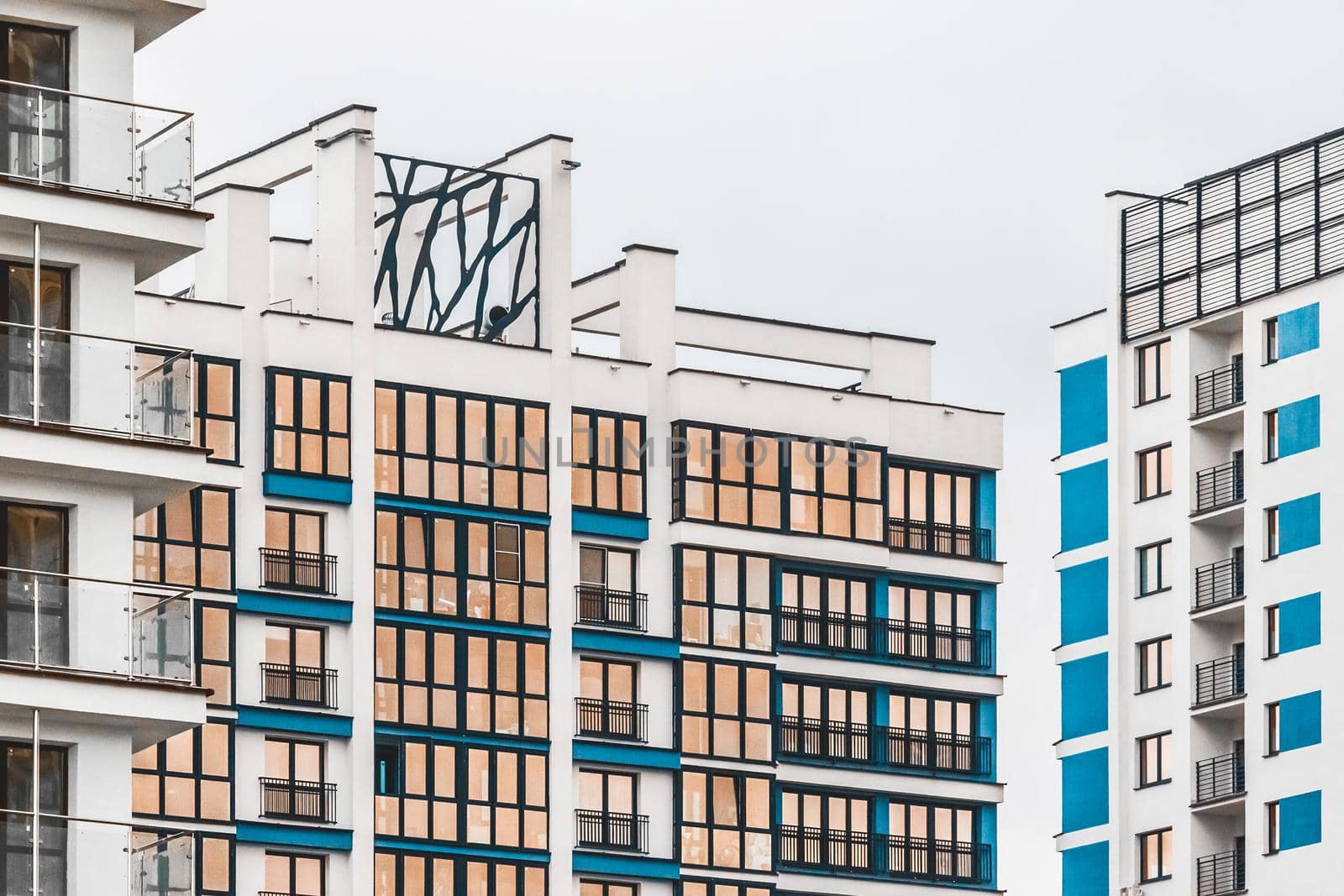 New modern high-rise apartment urban building exterior, facade of a residential city house.