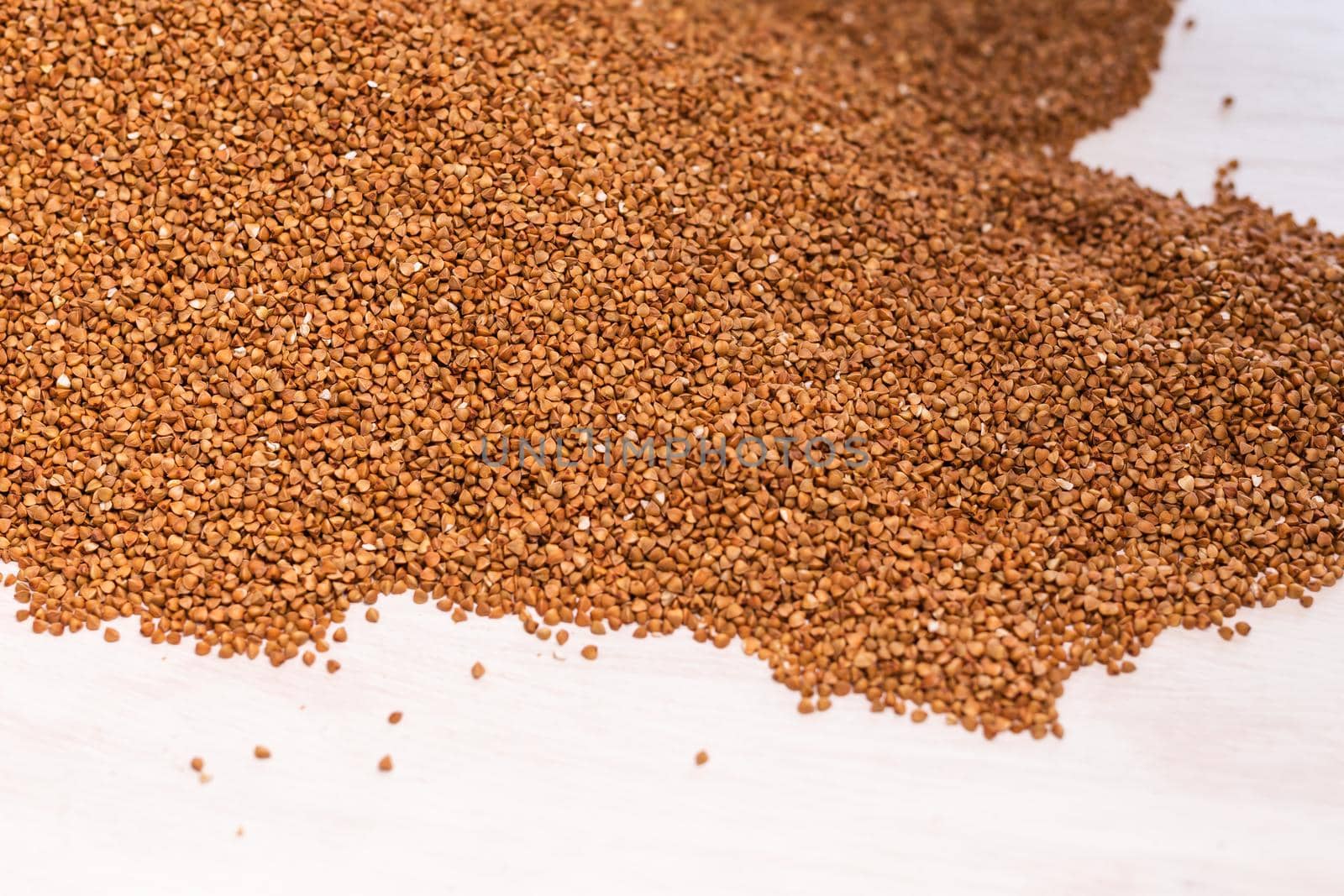 Fresh buckwheat background texture. Cereals and organic food concept.