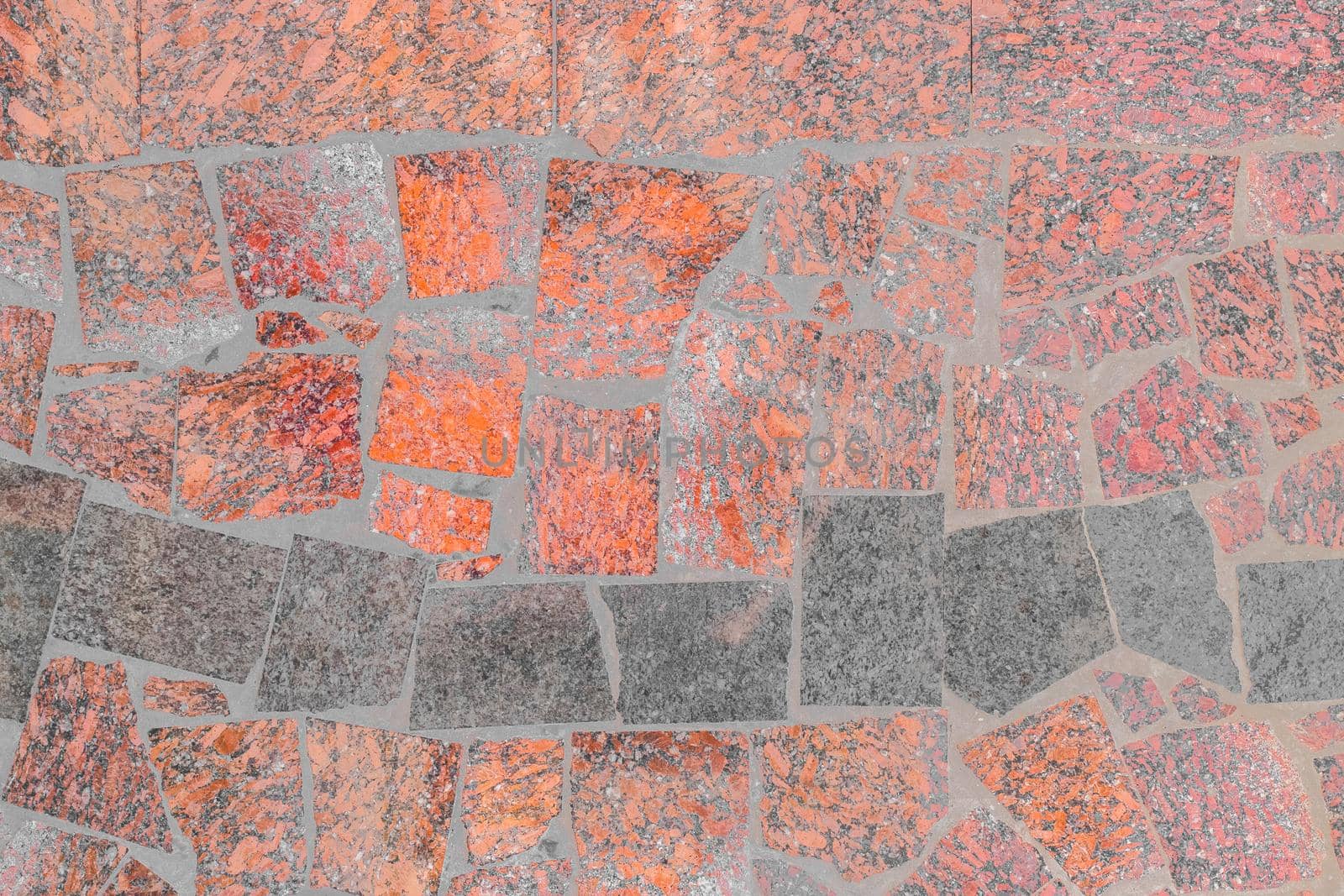 Color red and dark abstract pattern stone floor tiles background texture.