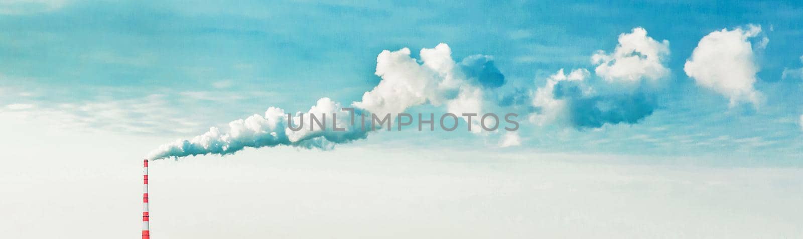 Environmental pollution, environmental problem, smoke from the chimney of an industrial plant or thermal power plant against a cloudy sky, panoramic view, high resolution.