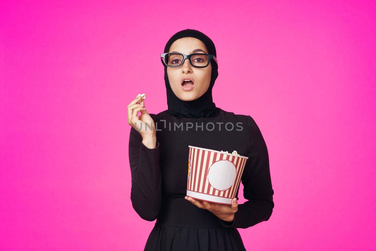 arab woman entertainment cinema popcorn fashion isolated background. High quality photo