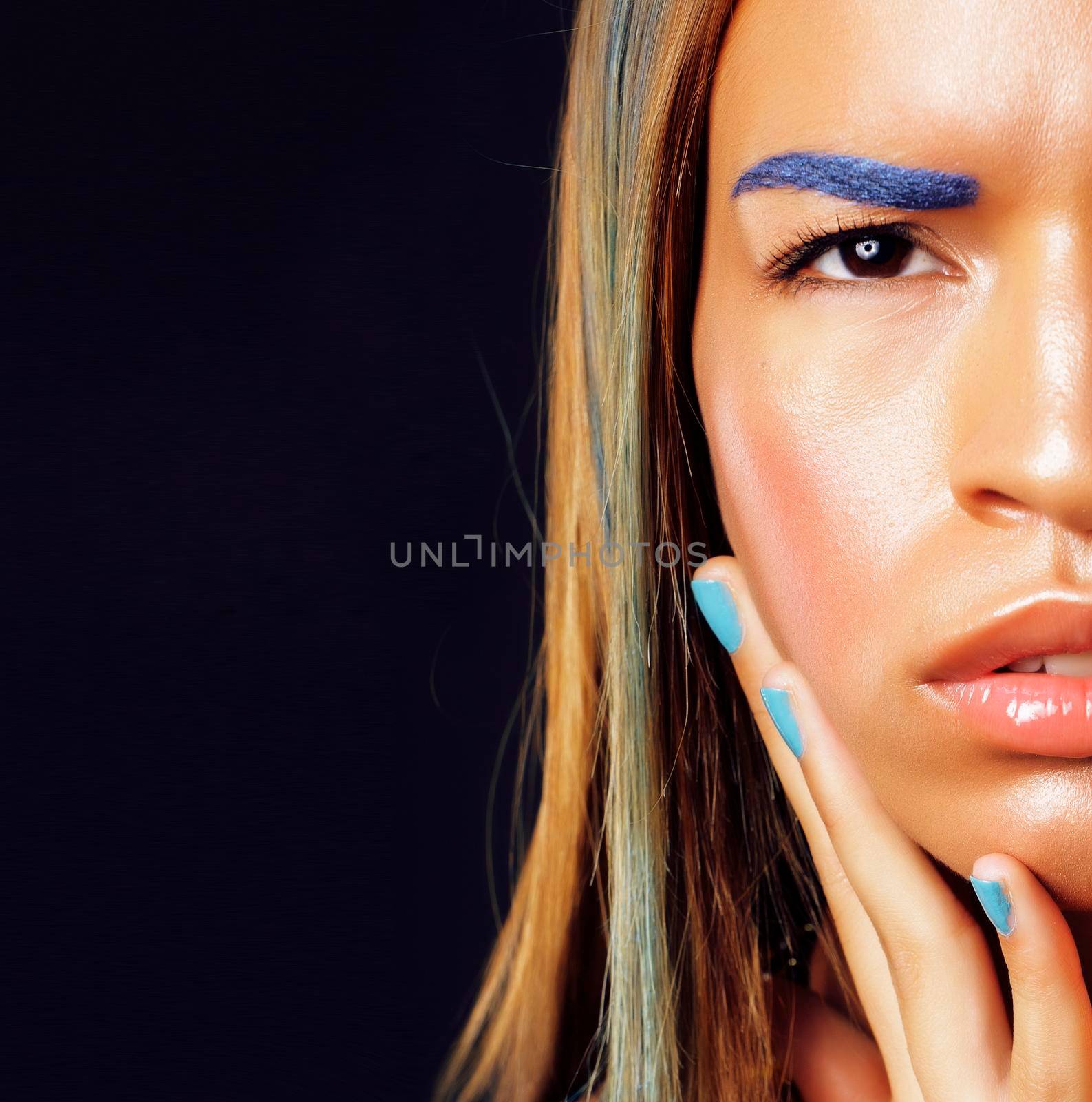 young african american woman with creative make up like ethiopian jewelry closeup dark background