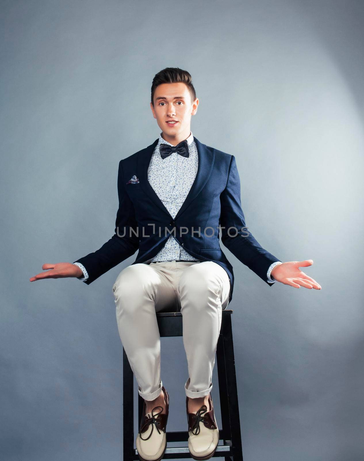 young pretty businessman posing emotional gesturing on white background, lifestyle people concept close up