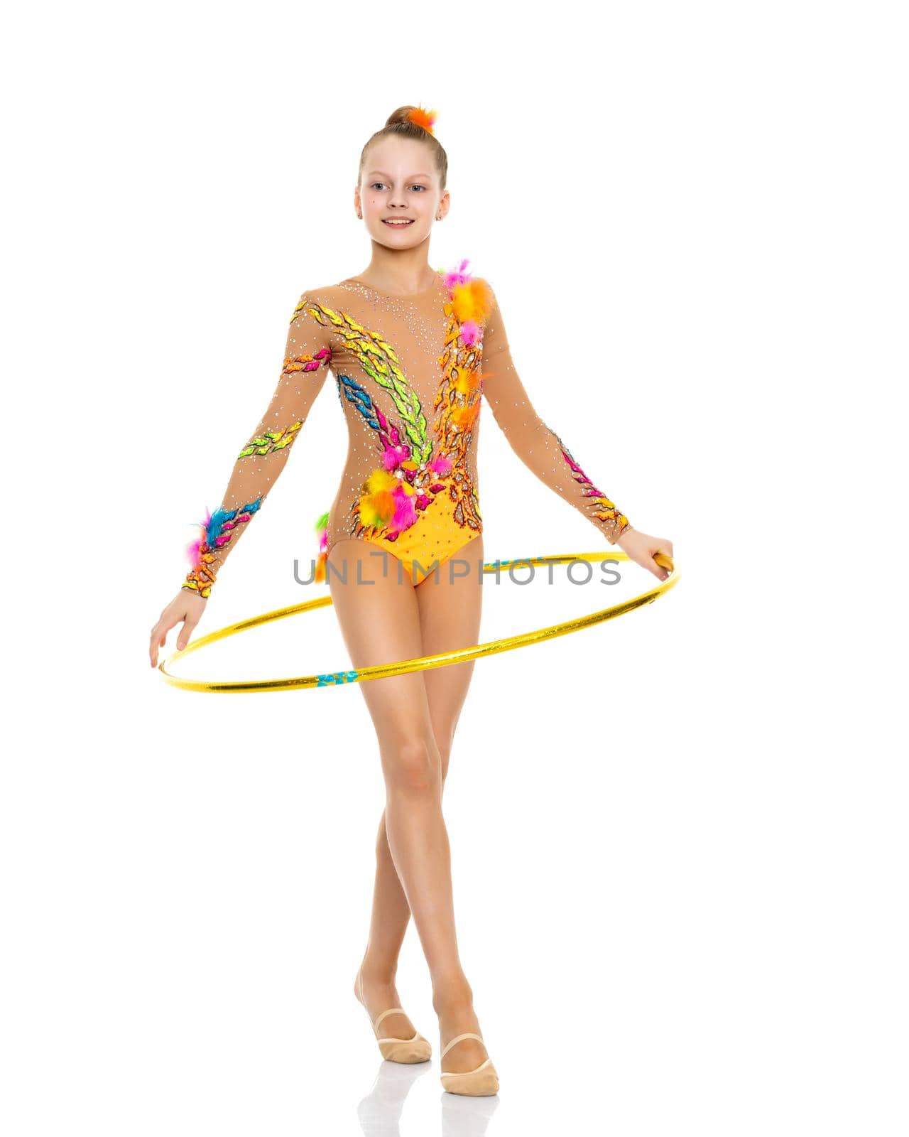 A girl gymnast performs an exercise with a hoop. The concept of gymnastics and fitness. Isolated on white background.