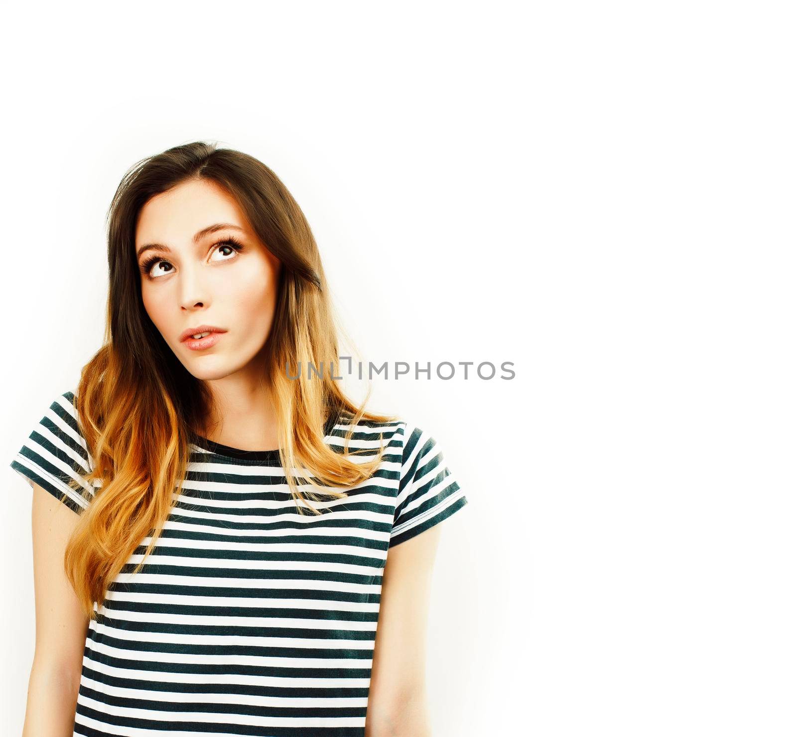 young pretty teenage hipster girl posing emotional happy smiling on white background, lifestyle people concept closeup