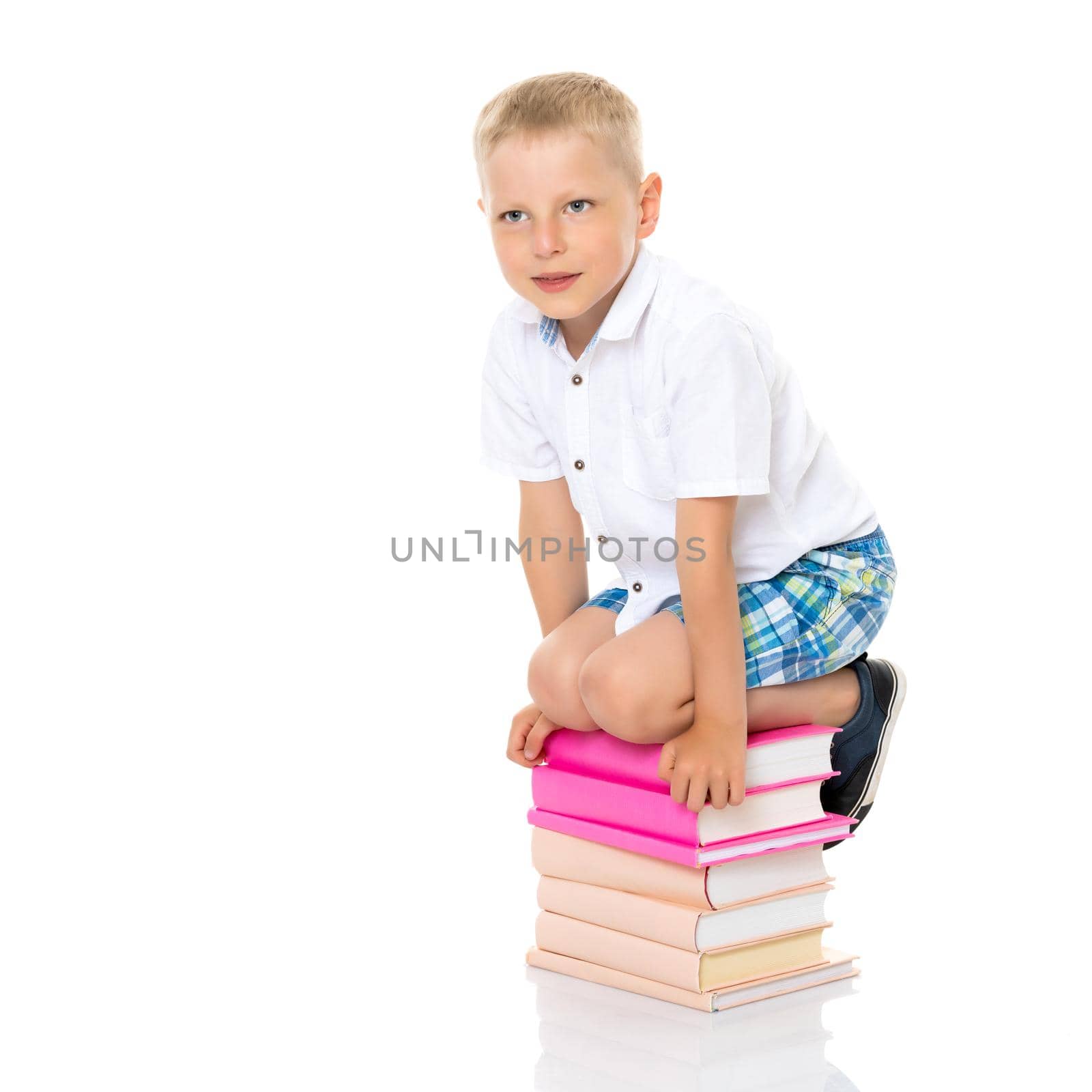 A little boy with books. by kolesnikov_studio