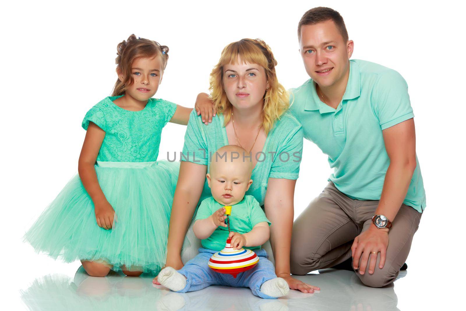 Happy family with young children. The concept of family happiness and development of children. Isolated on white background.