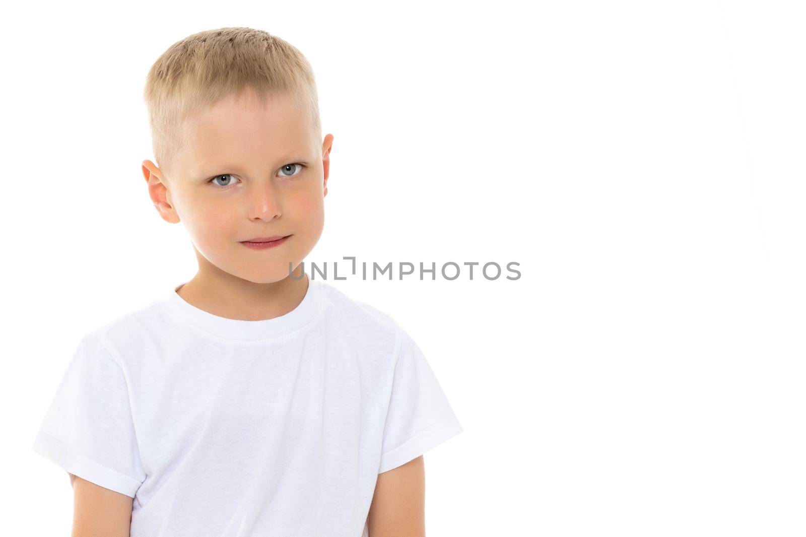 A little boy in a white T-shirt. by kolesnikov_studio