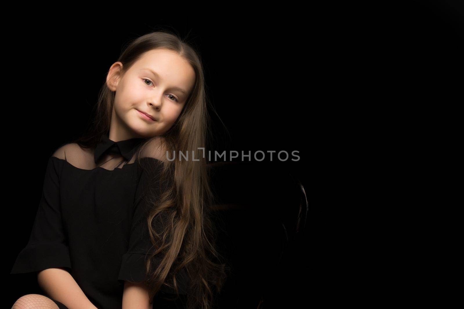 Portrait of happy smiling child girl. Laughing people. Positive emotions.Isolated on a black background.