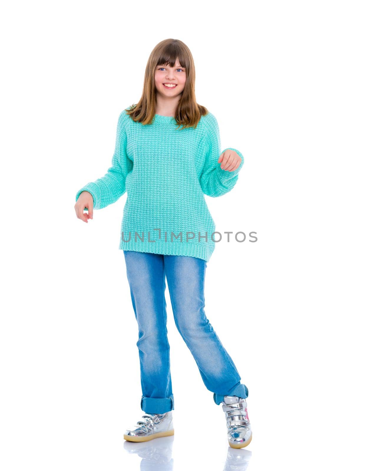 Beautiful little school girl with long silky hair. Studio portrait in full growth. Concept of style and fashion, happy people. Isolated on white background.