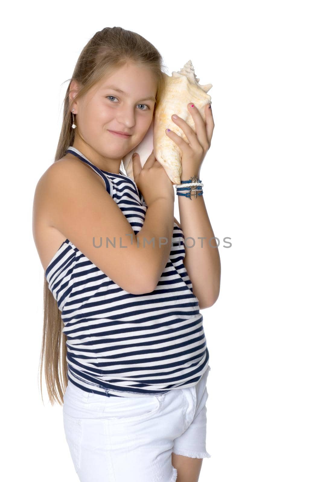 A teenage girl with a seashell. The concept of summer holidays, ecology. Isolated on white background.