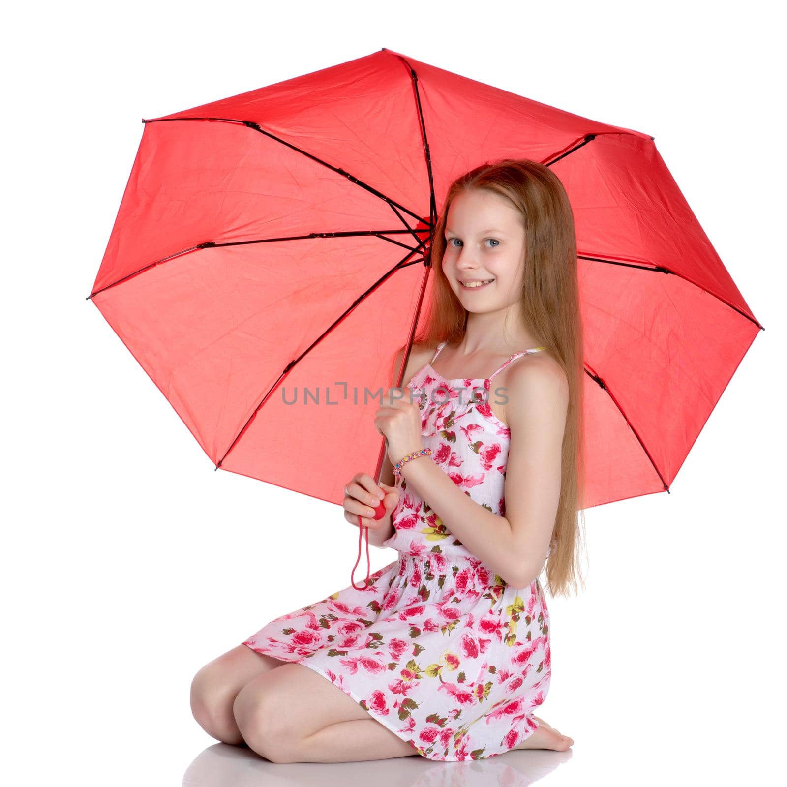 Beautiful teenage girl, in a summer dress under an umbrella. The concept of a happy childhood, summer outdoor recreation. Isolated on white background.